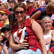 The perfect woman. A Redskin fan having fun drinking a beer.