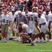 Coach lectures Redskin player.