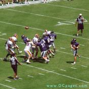 Raven's quarter back throws the ball over Redskins defenders.