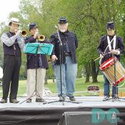 At the opening ceremony, volunteer gentlemen presented venerable march bugles of the Civil War. 