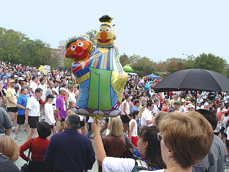 Sesame Street's Burt and Ernie float over the crowd.