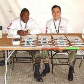 Members of the medical team take the time to smile before getting organized.