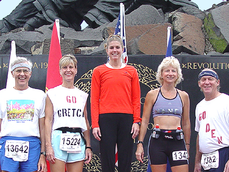 Nancy Stolzfus from Parksburg, PA & Cindy Chimino from Coolsville, PA & Gretchen Walter from York, PA & Dennis Faust from Mt. Joy, PA & Ralph McKinney from Wilmington DE...pose at winner circle before participanting in the 28th annual Marine Corps Marathon