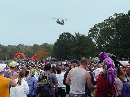 The CH-47D Chinook is a highly versatile heavy-lift helicopter. Its primary missions range from troop movements and artillery emplacement to battlefield resupply. This Chinook surveys the crowd.    