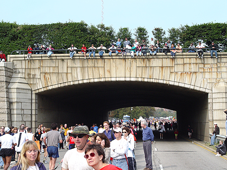 People watched the runners from the top of a bridge.