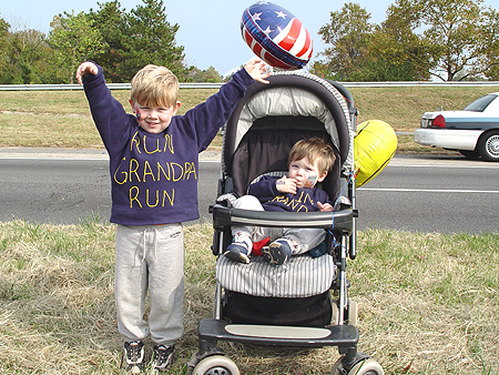 Two children wear swaetshits saying "Run, Grandpa, Run". Many people attended the race to show support to for their families.