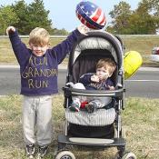 Two children wear swaetshits saying "Run, Grandpa, Run". Many people attended the race to show support to for their families.