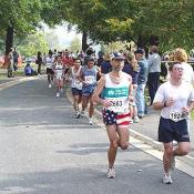 Runners pass through the grounds of the Washington Monument.