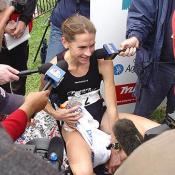 Hanscom answers questions from the press. She trains in the same group as Peter Sherry, the men's winner of the Marathon.