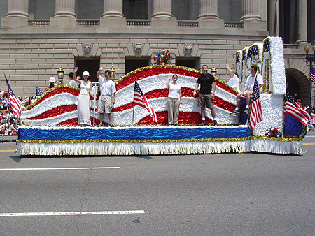 People from the USA float wave to the crowd