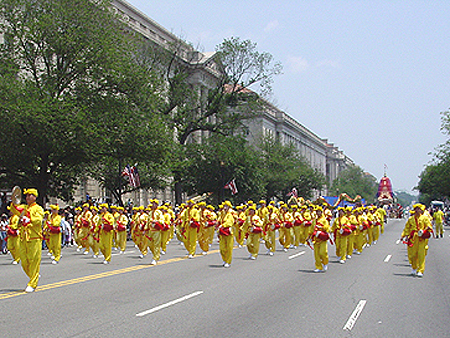 Cool yellow parade costumes created for Falun Gong representatives
