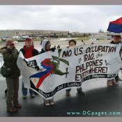 Filipinos group hold up sign - NO U.S. OCCUPATION in IRAQ, the PHILIPPINES & EVERYWHERE!