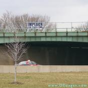 Sign above Pentagon bridge - IMPEACHFOREPEACE.ORG
