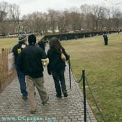 The Vietnam Memorial Wall both honors and serves as a painful reminder of the human cost and sacrifice of war.