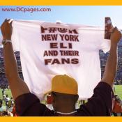A fan holds out a tee-shirt with the words - F#@K - NEW YORK - ELI - AND THEIR FANS.