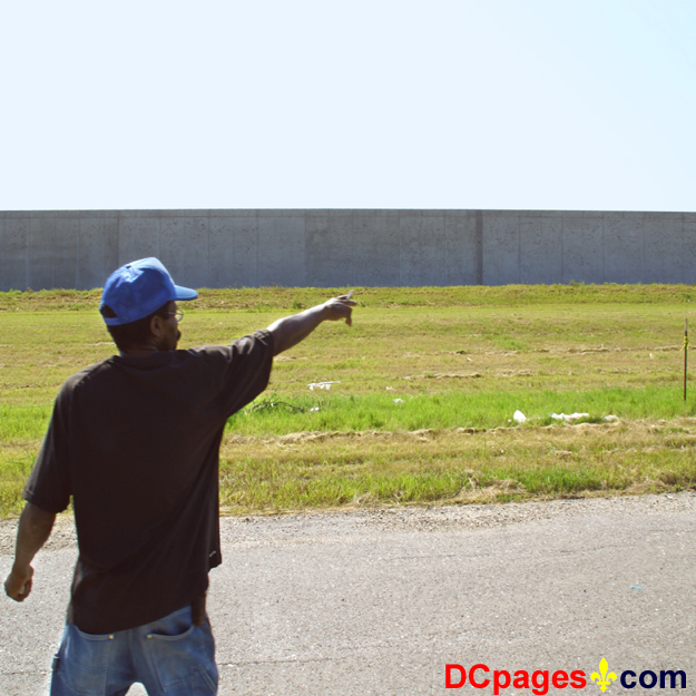 August 2, 2007 - Ninth Ward of New Orleans - Repaired Levee wall - Calvin Bernard points to where the wall broke.