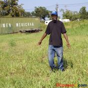 August 2, 2007 - Ninth Ward of New Orleans - Calvin Bernard points to where his home was located before Katrina.