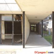August 2, 2007 - Ninth Ward of New Orleans - 5300 Law Sreet, New Orleans, 70117, LA 504-942-3602 - Alfred Lawless High School - Courtyard Hallway - Notice the broken windows.