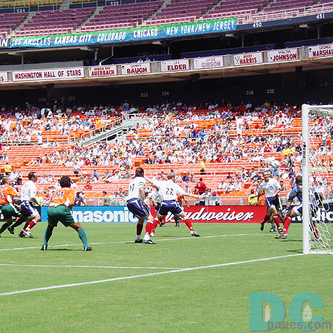 Players of the both team were competing each other at a goal chance from a corner kick.