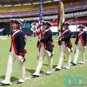 U.S. Army Continental Color Guard members were entering the soccer ground with flags. 