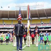 The officer of U.S. Continental Color Guard was singing the national anthem of the United States. 
