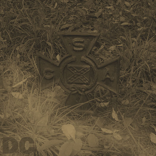 A low fog travels around a Confederate States of America (CSA) soldier grave marker. 