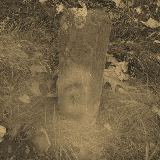 As I focused my camera on this head stone I noticed the water vapor formed into the head of a man looking at me. My heart slowed at what I was seeing. Then the mist was gone.