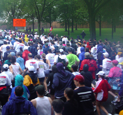 The runners are packed shoulder to shoulder at the beginning of the race