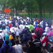The runners are packed shoulder to shoulder at the beginning of the race