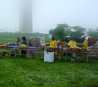Volunteers wait with food and refreshments for the runners to finish
