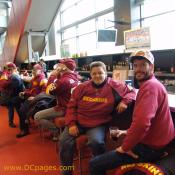 Redskins fans enjoy the warmth and a couple drinks before the game.