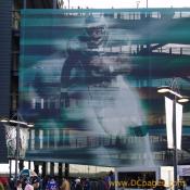 A 5 story tall Eagle running back is painted on a screen covering the stadium ramp stairs.