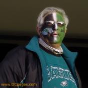 Eagles fan - Black, white, and green stripes on his face.