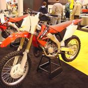 2004 CR250R is a 249cc liquid-cooled single-cylinder two-stroke with electronically controlled RC valve. Meet the only machine ever to go undefeated in the AMA National 250cc Motocross Championship.