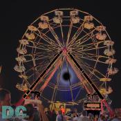 A photographic manipulation of a giant ferris wheel at the Montgomery County Agricultural Fair.