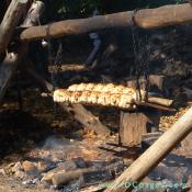 A closeup view of the fire. Roasting chickens are smoke seasoned until they are golden brown.