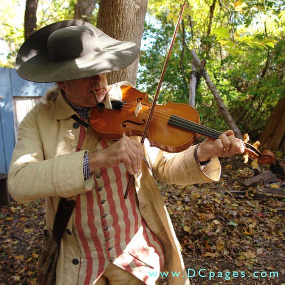 Fiddler, Ted Borek as 'Captian Samuel Slyke' plays a lively tune for the audience. Fiddles were a popular instrument of the time for the lower classes.