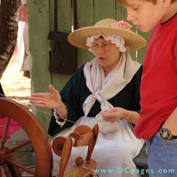 Sally Jenkins demonstrates how a spinning wheel works.