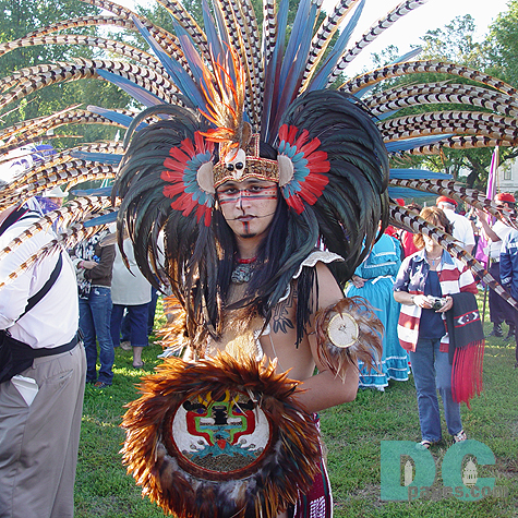 A member of the Aztec Nation displays a beautiful feathered head dress