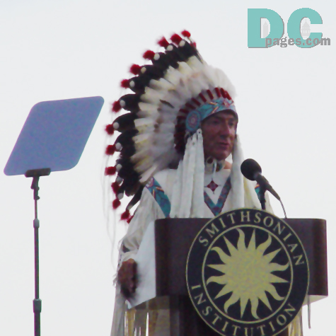 NAMI Director, W. Richard West clad in traditional Native dress gives remarks at the opening ceremony.
The National Museum of the American Indian is really a symbol for something bigger and more important than even that beautiful Native place just across the street.  And that is this: it is a symbol for the hope, centuries in the making, that the hearts and minds of all Americans, beyond this museum and throughout the Americas, will open and welcome the presence of the first peoples in their history and in their contemporary lives. 