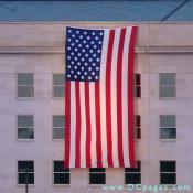 As the procession moved toward the Pentagon, gasps arose from the crowd when they caught their first glimpses of a huge, lighted American flag hanging from the side of the building -- reminiscent of the flag hung hours after the Sept. 11 attack.