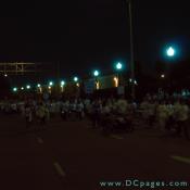 As night approaches an army of blue glow sticks and white shirts march into the Pentagon reservation.