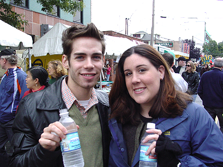 Jessica and James enjoy a refreshing drink of water from the Drink More Water stand.