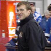 General Manager George McPhee smiles for the camera.