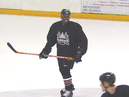 Mike Grier is all smiles as he skates across the ice.
