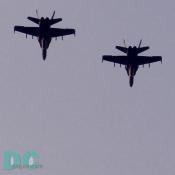 Two F/A-18 Hornet fighter planes fly over Navy-Marine Corps Memorial Stadium. The single-seat F/A-18 Hornet is the nation's first all weather strike-fighter.