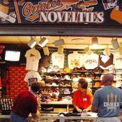 Fans and souvenir vendors watch Orioles score on tv!