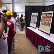 Fans wait in line to view Redskins Super Bowl winning team photos and trophies.