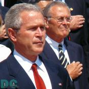 Closeup of President George W. Bush, Secretary of Defense, Donald H. Rumsfeld is in the background.