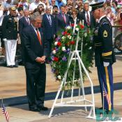 President George W. Bush bows his head in respect for the many servicemen and women who died for our country.